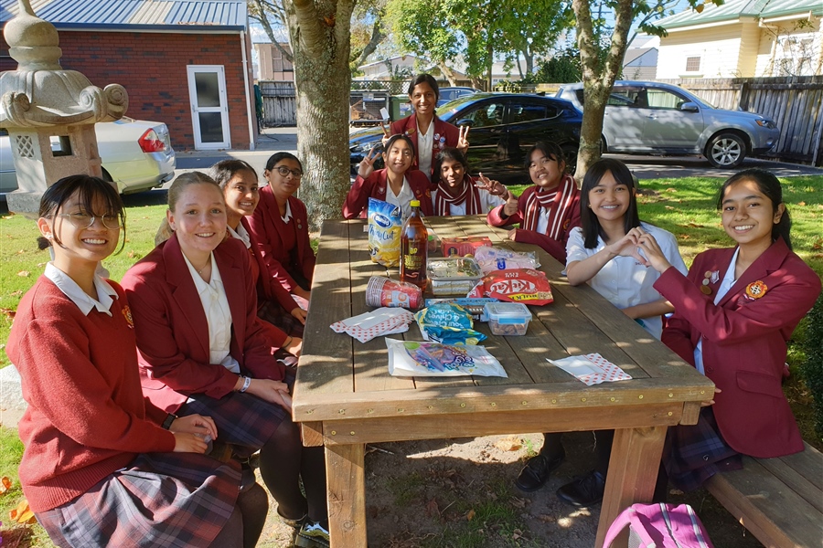 Sarah and friends enjoying Kiwi snacks.